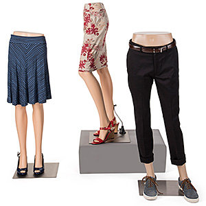 These mannequin leg forms place the emphasis on skirts or pants Grouping of three mannequin leg forms with clothing