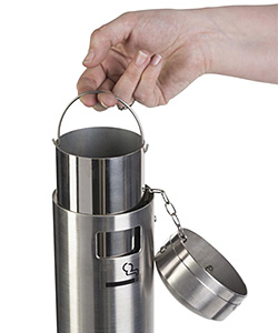 Outdoor ashtrays provide safe extinguishing of cigarettes in front of commercial businesses Closeup of an outdoor ashtray with lift out dispenser