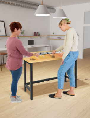 Provide people with easily digestible digital content with our touch screen kiosks Woman Tapping on a Touch Screen Kiosk