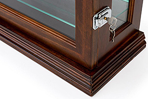 Showcase your items the professional way with wood display cases. Closeup of a solid wood display case with door lock