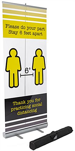 Printed Social Distancing Banner on Clear Film Includes Carrying Case for Easy Transport Printed social distancing banner on clear film with black nylon carry bag