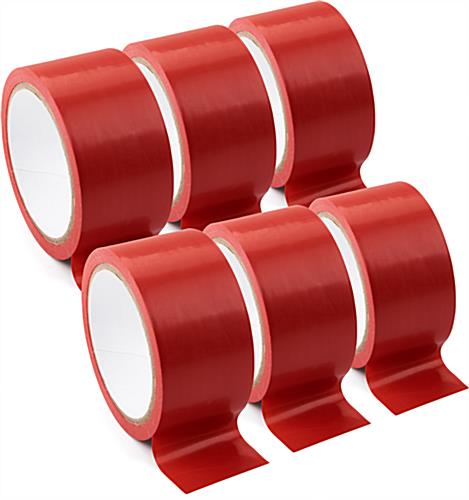 Red vinyl floor tape will adhere to cement floors