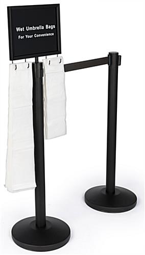 Gray Belt Stanchion Umbrella Station is a Low Cost Solution to Minimize Slip and Fall Accidents Gray belt stanchion umbrella station with 2 posts and signage