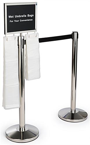 Silver Stanchions with Umbrella Bag Holder - Combines Crowd Control with Guest Safety Silver stanchions with umbrella bag holder and safety-conscious signage