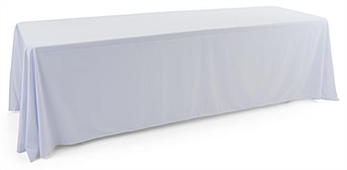 This White Polyester Table Cover for Special Occasions White polyester table cover with a draping display