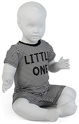 Sitting Baby Mannequin Dressed with Props Propped Shot of Sitting Baby Mannequin