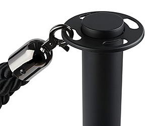 Closeup of a black rope stanchion post