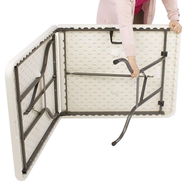 Woman opening up a folding table