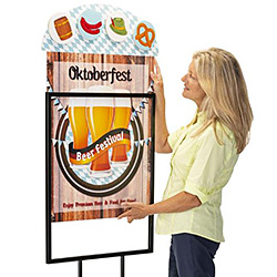 Woman inserting an arched top foam board sign into a 22x28 floor stand