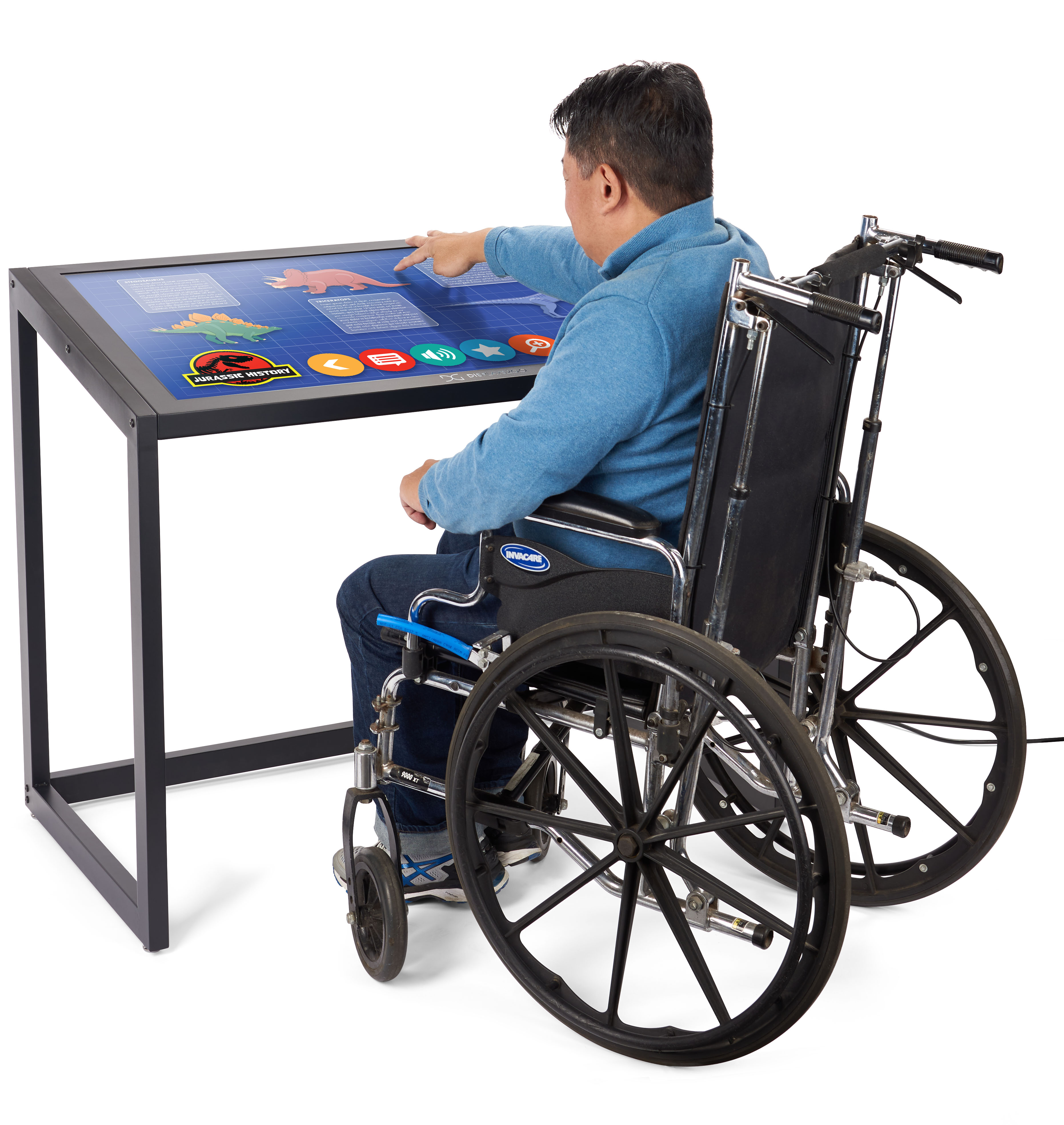 Man in wheelchair using touch screen table