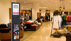 Digital sign stand paired with slots for literature