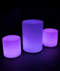 Illuminated cocktail table set shown in purple lights