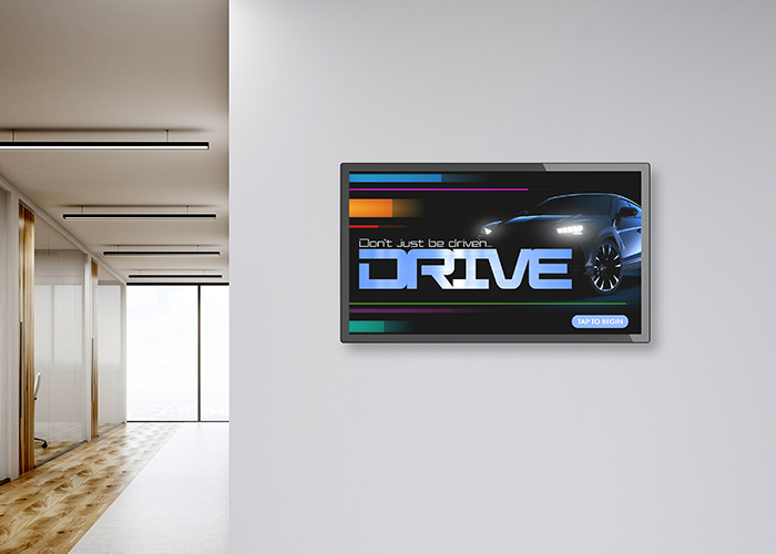 interactive wall mounted monitor hanging on a wall of a car dealership