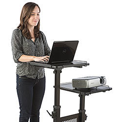 Woman working behind a mobile laptop stand