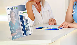 Countertop sign frame with an attached brochure holder