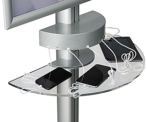 Closeup of a charging station with plugged-in cell phones.