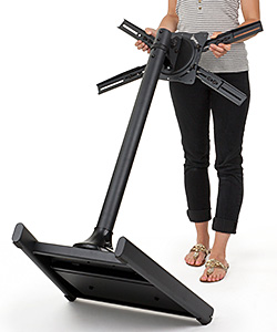 Woman Moving a TV Stand with Casters