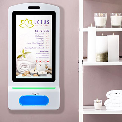 A wall mounted hand sanitizing station inside a spa