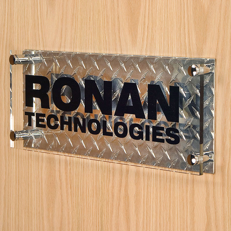 This dual-layer sign features a diamond plate backer
