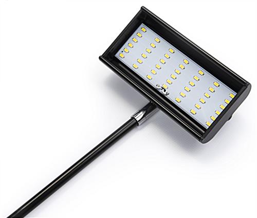 LED exhibit stem light with low profile tilting top