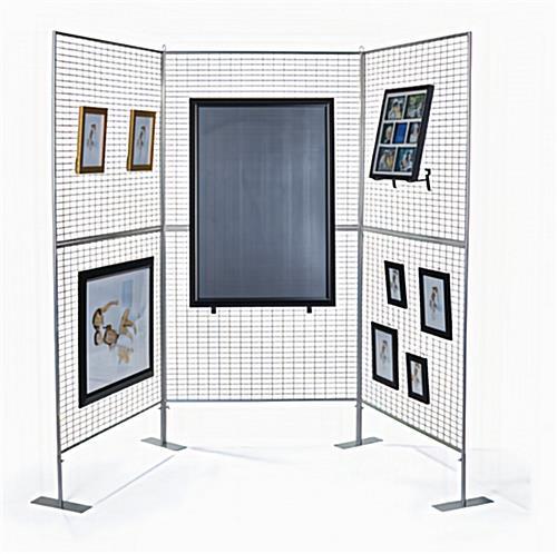 Three powder coated lightweight silver iron art mesh display panels displaying framed artwork