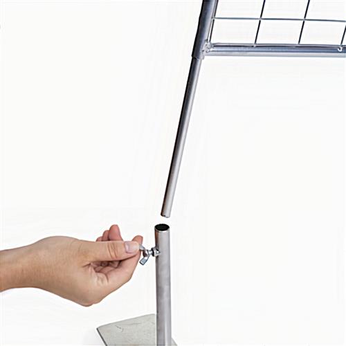The bottom poles on the panels insert easily into the base, which has a screw to tighten them