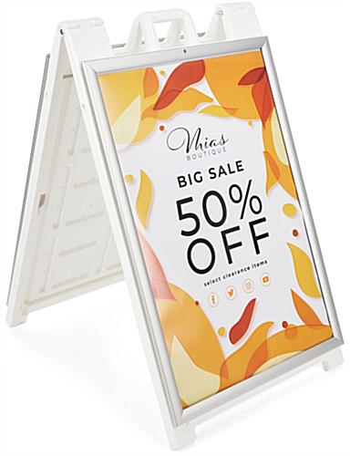 White snap open a-frame sidewalk sign measures 27 inches wide by 46 inches tall 