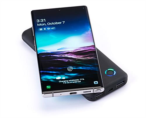 Black wireless charging promotional power bank with powering indicator light