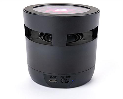 Black branded tech gift sample kit includes wireless charging speaker