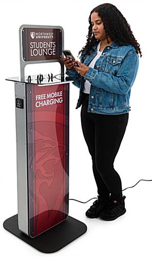 Phone charging station kiosk with custom graphics can simultaneously charge 12 devices
