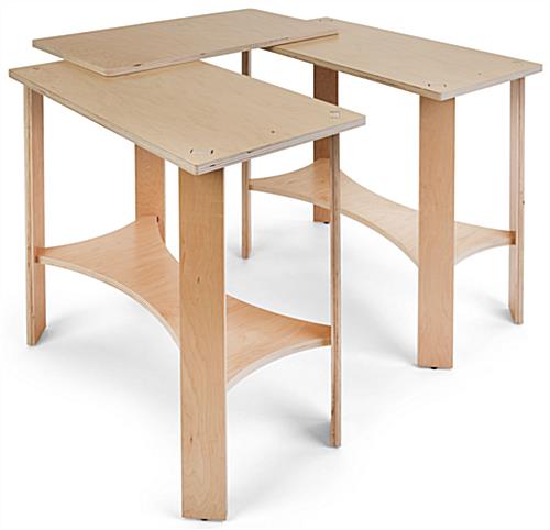 Collapsible wooden display tables with three individual tabletops 