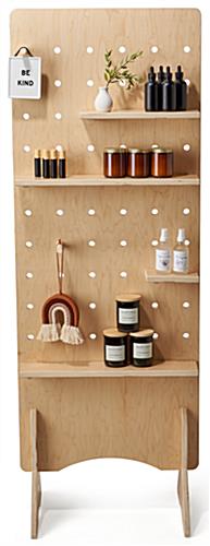 Modern pegboard shelving measures 24 inches wide by 69 inches tall 