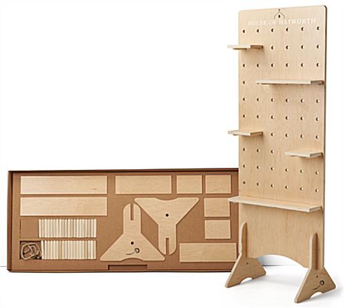 Wooden pegboard floor display with flat pack carrying case 