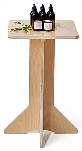 Collapsible wooden retail pedestal with flat pack design 