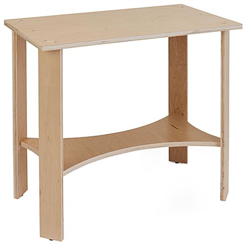 Wooden knockdown display table with protective plastic feet 