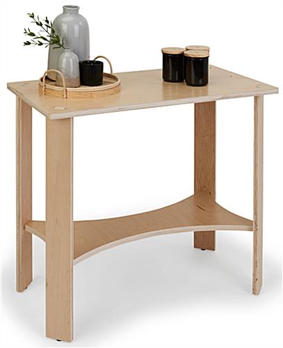 Wooden knockdown display table measures 30 inches wide by 28 inches tall