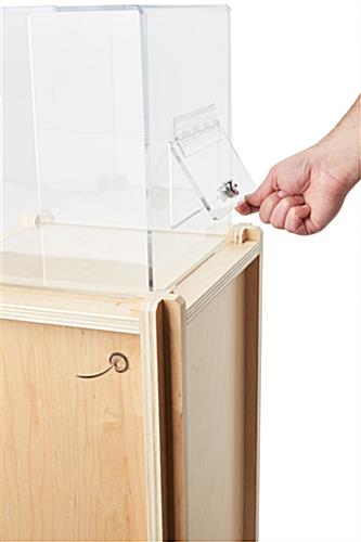 Floor standing donation box with locking door