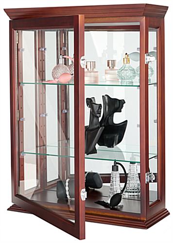 Wall mounted curio cabinet with locking hinges 