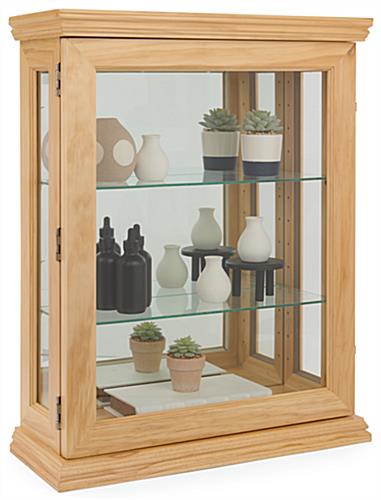Economical oak curio cabinet with mirrored back panel