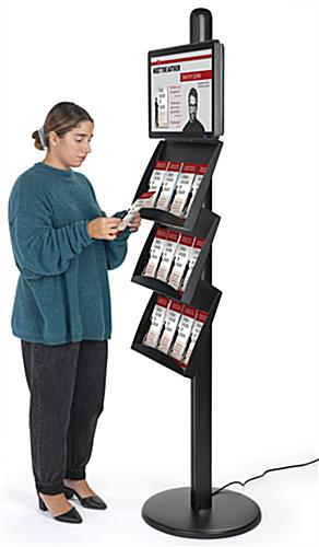 Freestanding literature holder with advertising screen and multi-channel USB interfaces