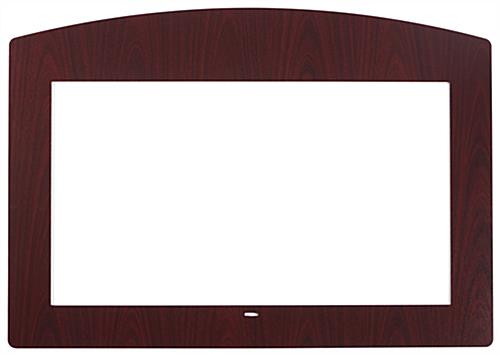Adhesive decorative faceplate for commercial monitors with faux mahogany veneer