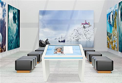 Touch screen kiosk with edge lights in an art gallery lobby