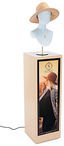 Oak display pedestal with LCD screen and mannequin head with had displayed on top