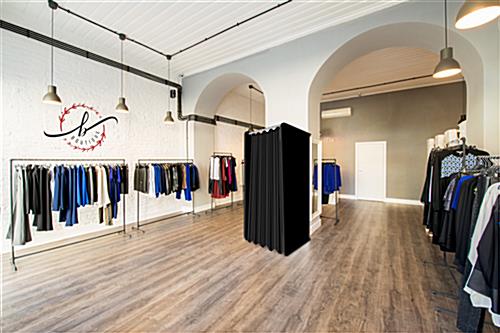 Pop-up black dressing room booth in retail environment