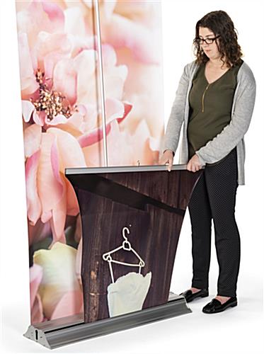 3D layered roll up banner stand easily and conveniently retract into base