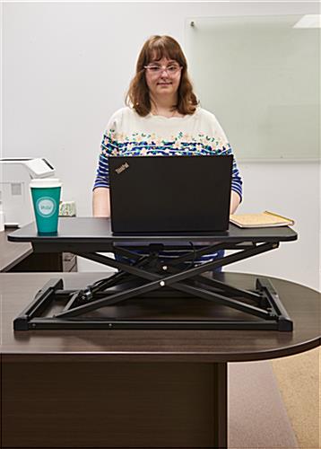 Gas-lift sit-stand desk converter promotes body movement 