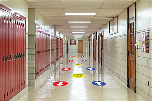 Removable 12 inch directional floor sticker for line spacing