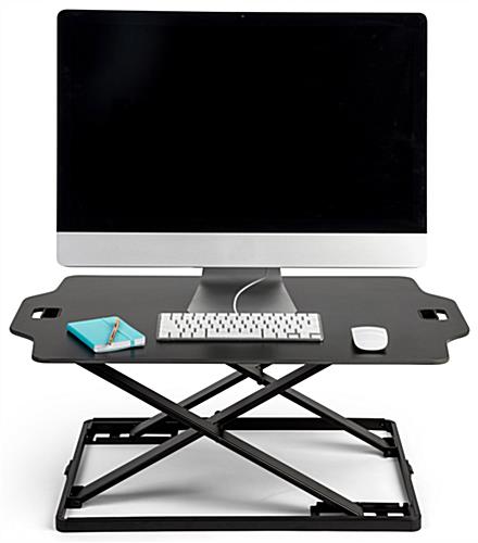Fold-in standing workstation riser with preset height settings