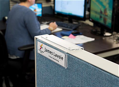 Adjustable acrylic cubicle name plate holder shown in office setting