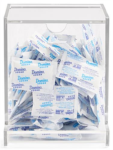 Single use packet dispenser with front lip